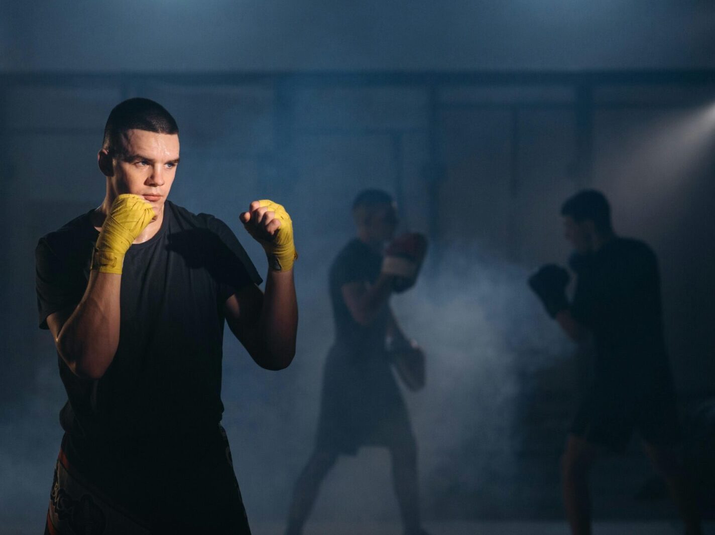 Martial artist practicing on a rooftop, against a city skyline backdrop.
